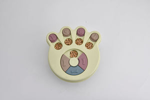 Paw-shaped pet toy with colorful interior on a light gray background at Pet Servo