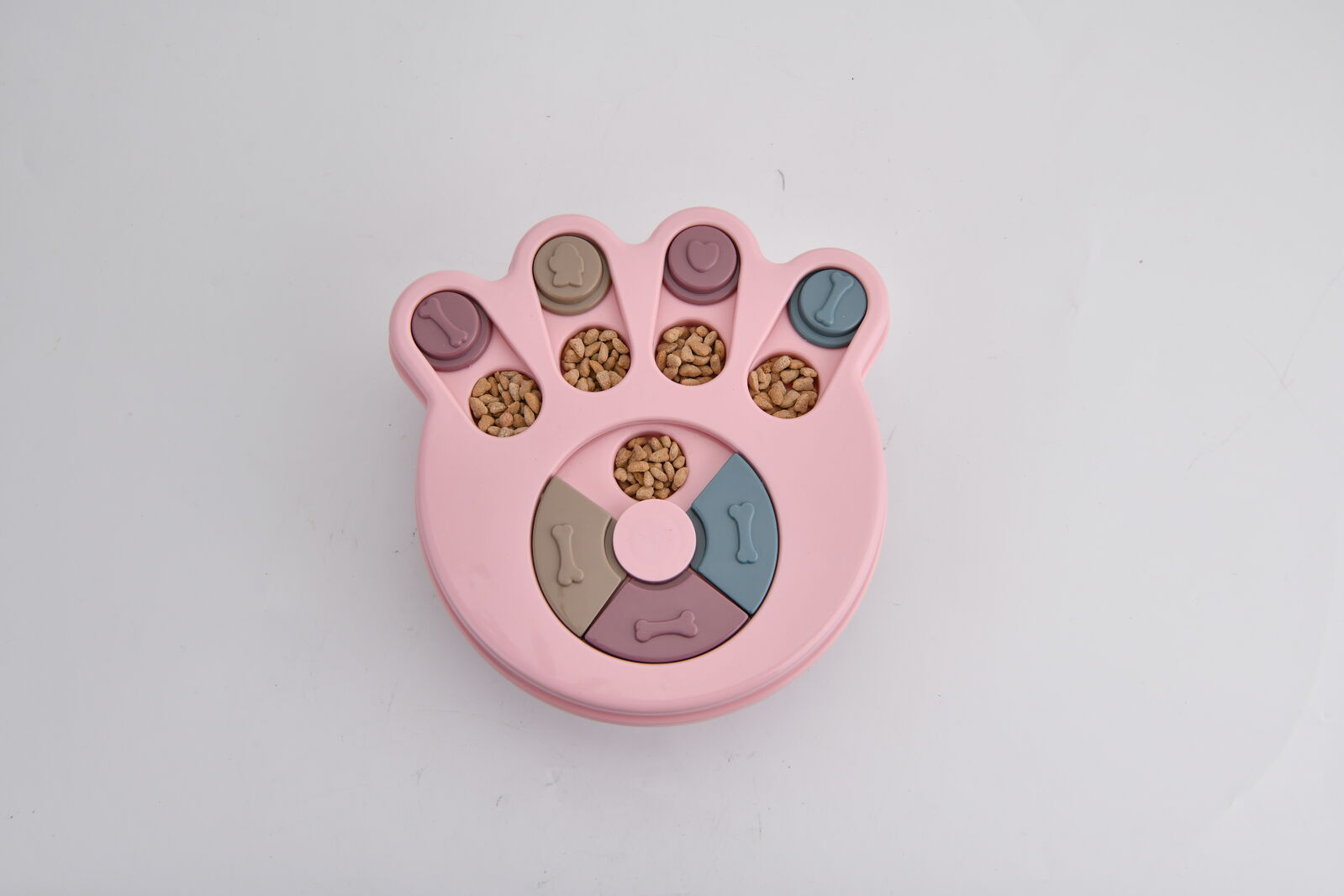 Pink paw-shaped pet toy with compartments on a light gray background at Pet Servo