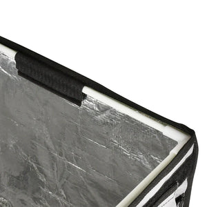 Close-up of a reflective surface with a black border on a white background