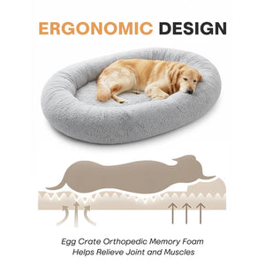 Dog lying on a gray ergonomic donut bed with an illustration of the egg crate orthopedic memory foam at Pet Servo