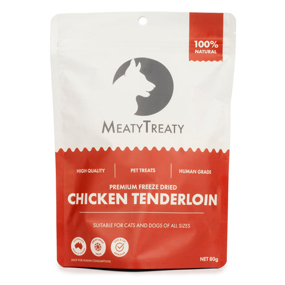 A 80g stand-up pouch of MeatyTreaty Premium Freeze Dried Chicken Tenderloin pet treats, designed for cats and dogs of all sizes. The packaging is white on the top half with a dark gray cat silhouette logo, and red on the bottom half with white text.
