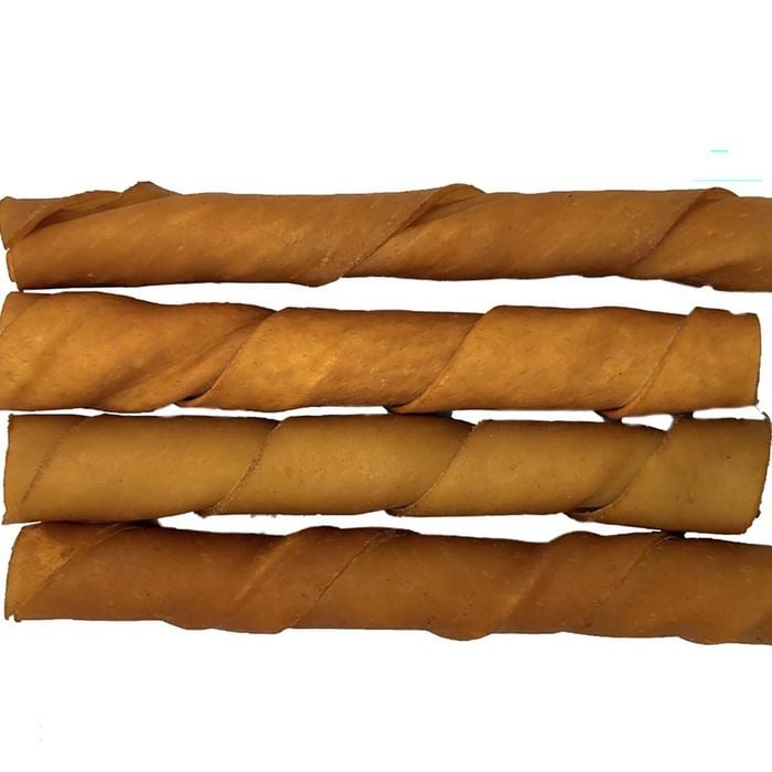Three twisted wooden stakes on a white background