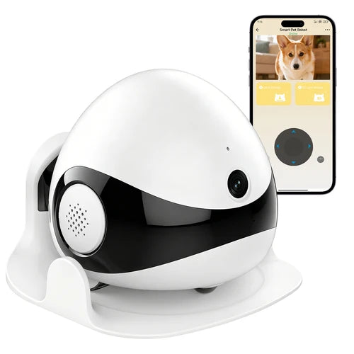 A white and black smart pet camera device on a white charging stand, shown alongside a smartphone displaying a pet camera app with a dog photo at Pet Servo