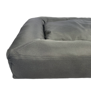 Gray dog bed on a white background