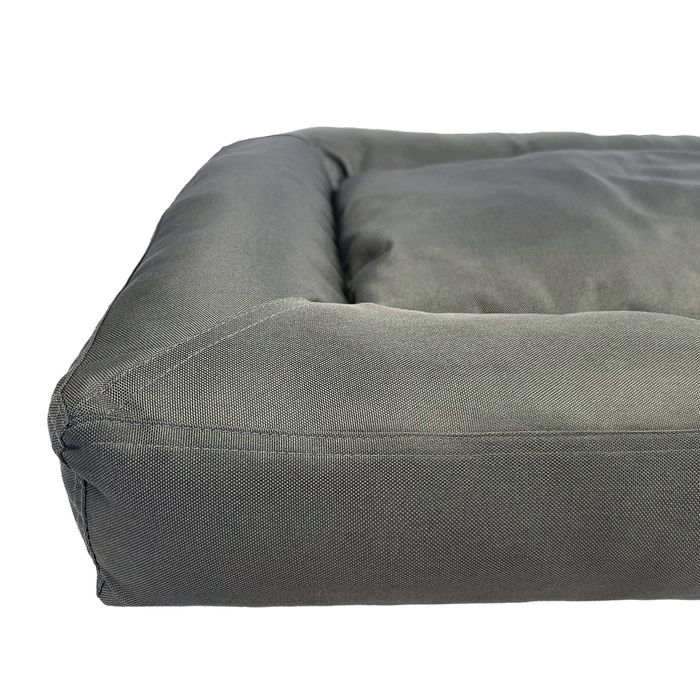 Gray dog bed on a white background