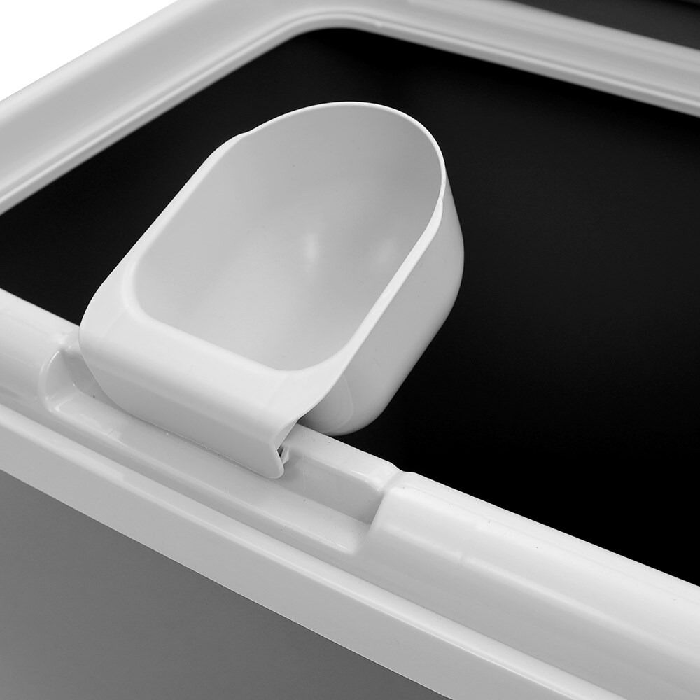 Close-up of a white plastic component on a black background at Pet Servo