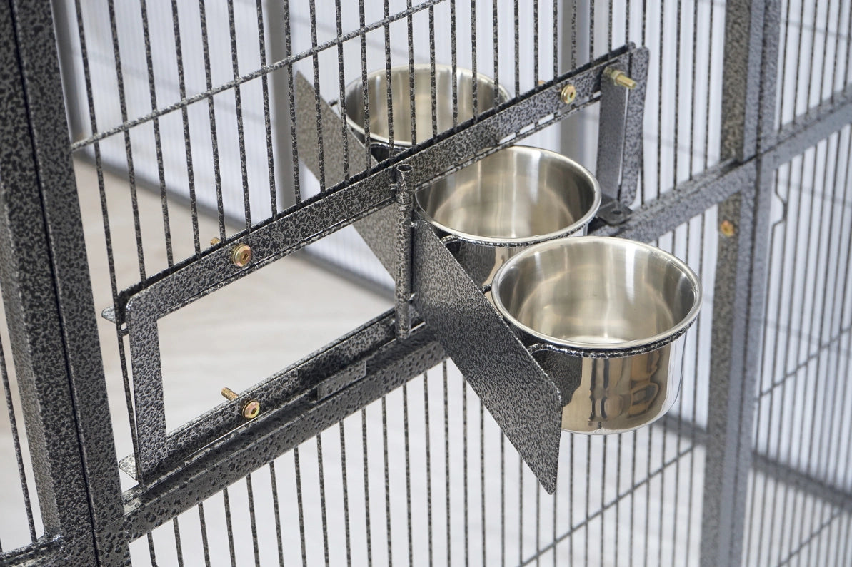Metal bird cage with stainless steel bowls attached to the side at Pet Servo