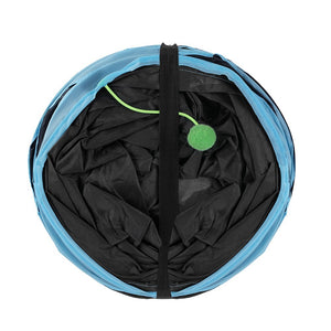 Black bag with a green tag inside a blue bag on a white background at Pet Servo