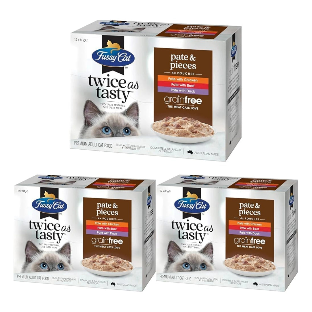 Three boxes of Fussy Cat grain-free cat food on a white background
