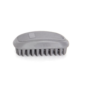 A gray pet grooming brush with soft silicone bristles, shown from a top-down view on a white background.