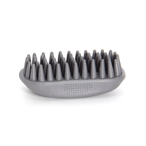 A gray silicone pet grooming brush with dense, cone-shaped nubs on a matching oval base, shown against a plain white background.
