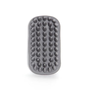 A dark gray silicone massage brush with rounded rectangular edges and rows of raised dome-shaped nubs, shown on a clean white background.