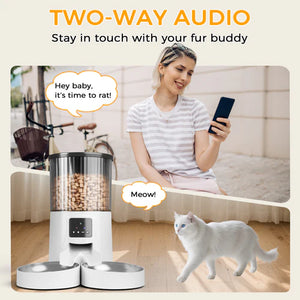 Woman using a smartphone with a pet feeder and cat in a home setting, emphasizing two-way audio feature at Pet Servo