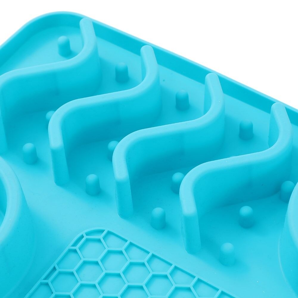 Close-up of a blue silicone mold with wavy patterns on a white background at Pet Servo