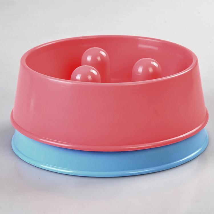 Pink and blue plastic toy with three balls inside on a white background at Pet Servo