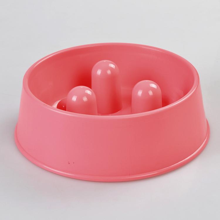 Pink plastic toy with three spherical indentations on a light gray background at Pet Servo