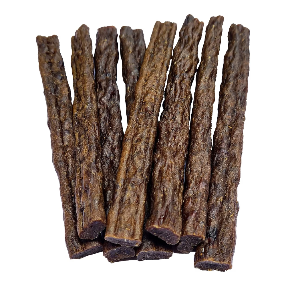 A pile of dark brown textured jerky sticks on a plain white background.