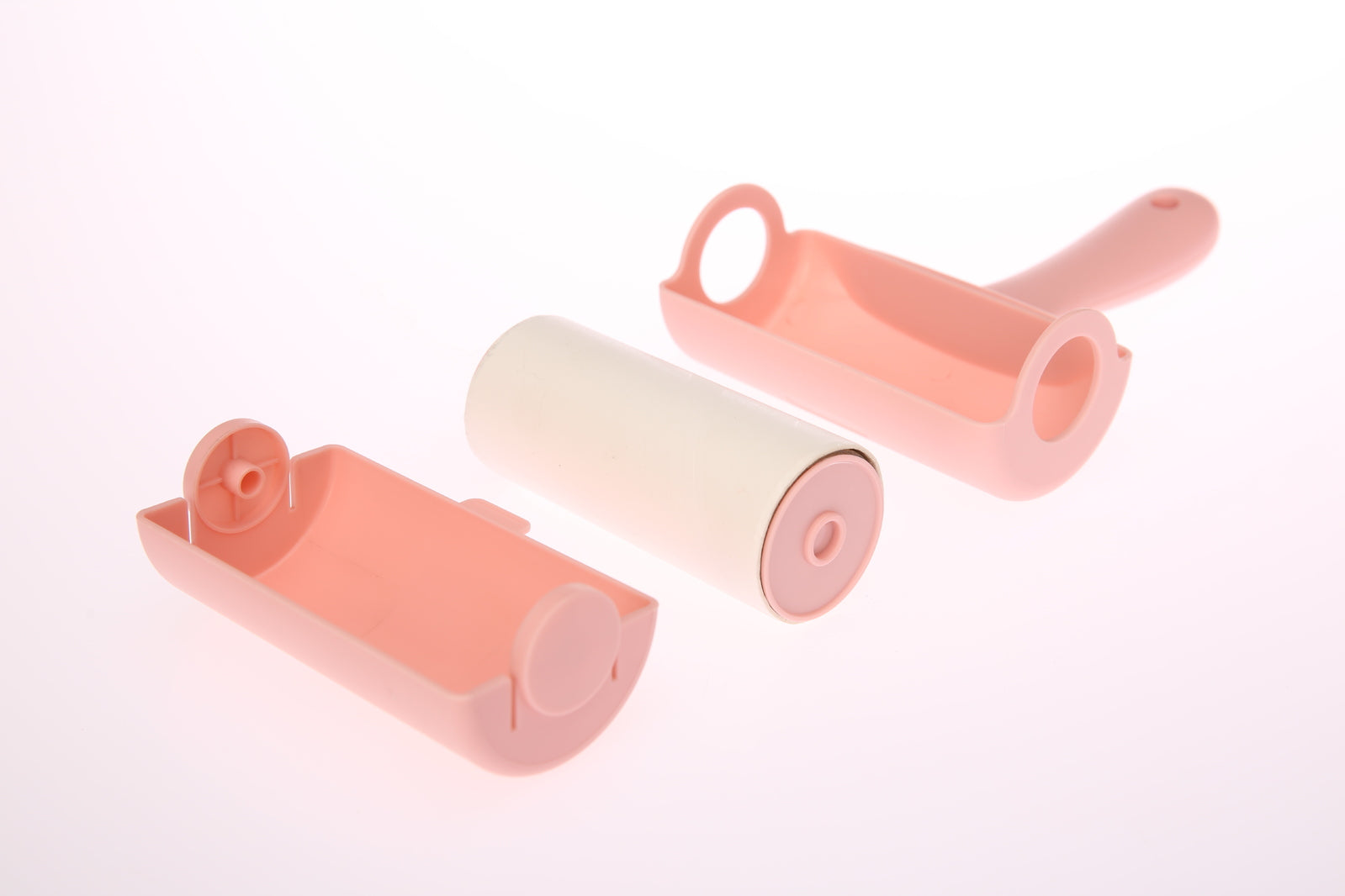 Two pink and one beige roller brush set on a white background at Pet Servo