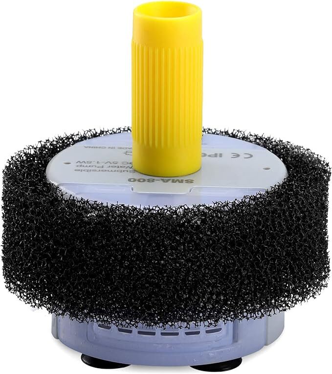 Black scrubber with yellow handle on a white background at Pet Servo