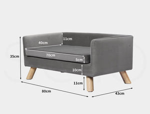 Gray pet bed with wooden legs and dimensions labeled on a white background at Pet Servo