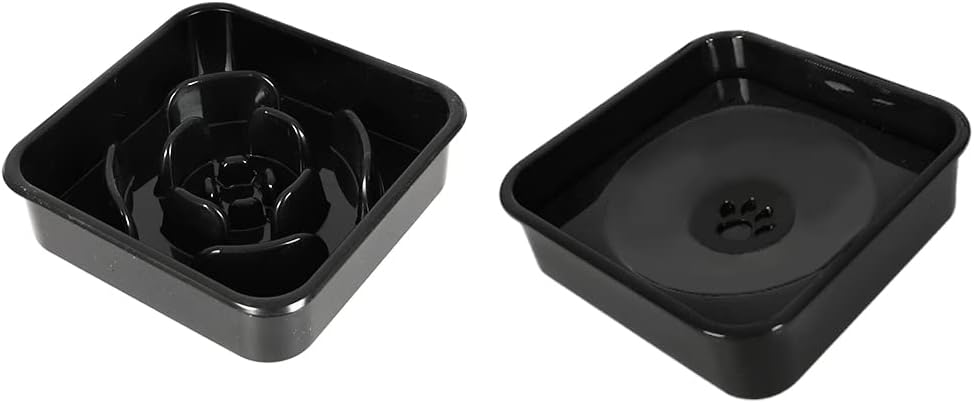 Two black slow feeder bowls shown side by side on a plain white background, one displaying the rose-shaped internal channel and the other showing the bottom drain with a paw print cutout at Pet Servo