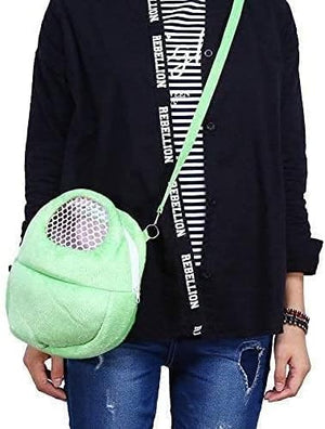Person holding a green plush bag with a black shirt and jeans at Pet Servo