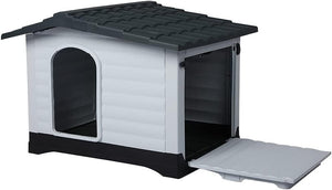 A small plastic doghouse with a white textured exterior, dark gray roof, black base, and an open front door with a hinged light gray flap, shown on a plain white background at Pet Servo