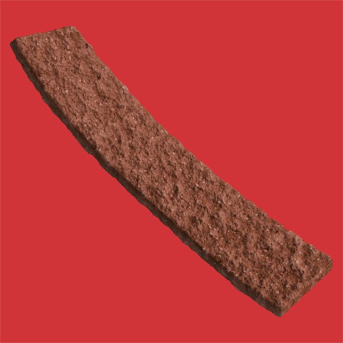 A textured rectangular brown stone or concrete sample shown diagonally on a solid red background.