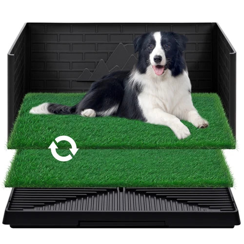 A black plastic dog pee station with two green artificial turf mats, shown with a black-and-white dog lying on the top mat. A white circular arrow icon is visible on the front of the turf at Pet Servo