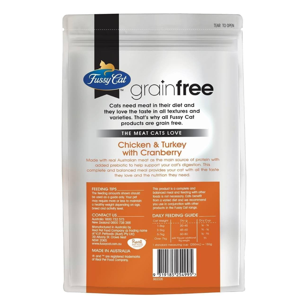 Fussy Cat grain-free cat food package with chicken, turkey, and cranberry ingredients on a white background.