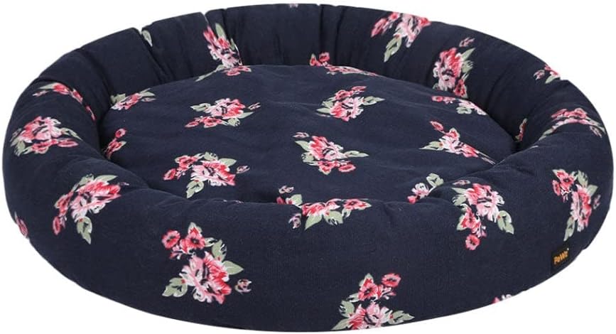 A round, tufted pet bed in navy blue fabric with a pink and green floral pattern, shown against a plain white background at Pet Servo