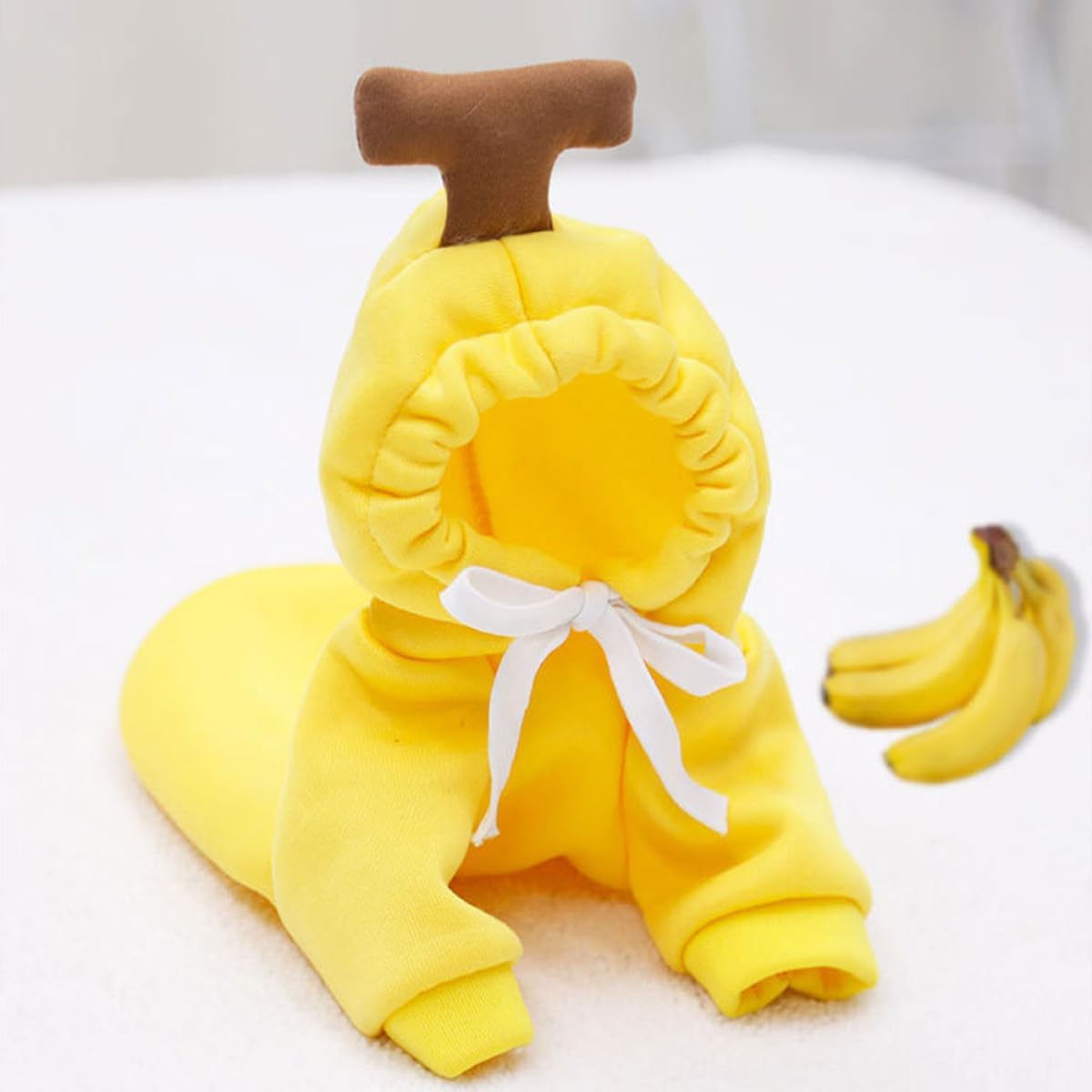 Yellow banana-themed baby outfit with a white background at Pet Servo