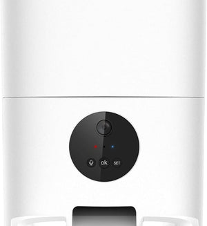 Close-up of a white appliance front panel with a circular black control pad featuring a camera lens, a red indicator light, a blue indicator light, and buttons labeled OK and SET at Pet Servo