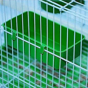 Green plastic tray inside a wire cage at Pet Servo