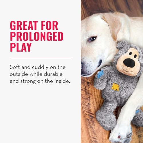 Dog playing with a plush toy on a wooden floor, with text about the toy's durability and play value at Pet Servo