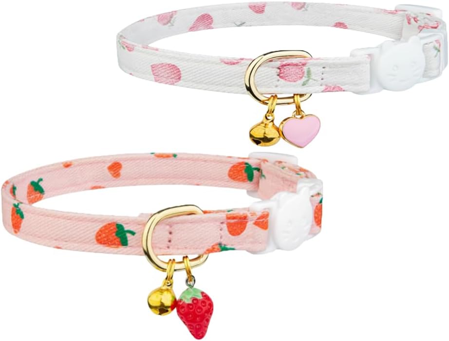 Two cat collars with strawberry patterns and small charms on a white background at Pet Servo