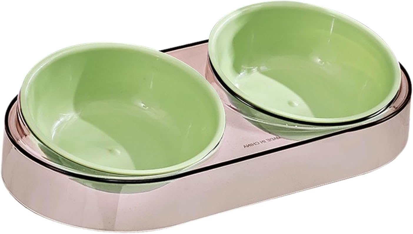 A double pet bowl set featuring two light green ceramic bowls nested inside a metallic rose gold base, shown on a plain white background at Pet Servo