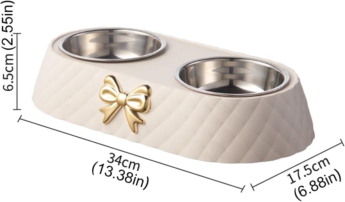 A dual pet feeder bowl set with a cream quilted base, stainless steel bowls, and a gold bow accent, shown with dimension lines and measurements on a white background at Pet Servo