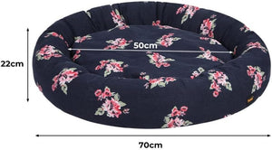 A round pet bed with a dark navy floral print, showing dimension markings of 70cm width, 50cm depth, and 22cm height on a white background at Pet Servo