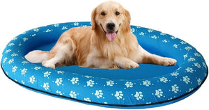 Dog lying on a blue inflatable pool with paw prints, on a white background at Pet Servo