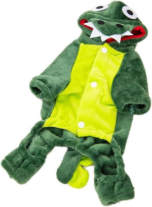 A plush dinosaur costume for toddlers, featuring a green hooded body with a smiling face, white teeth, and large eyes, a bright yellow-green front panel with white snap buttons, and matching green foot covers, shown on a plain white background.