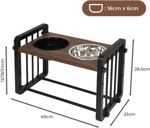 An elevated pet feeder stand with a dark brown wood-grain top, black metal frame, and two bowls (one black, one stainless steel), shown with dimension labels and a size badge indicating 16cm x 6cm bowl size at Pet Servo
