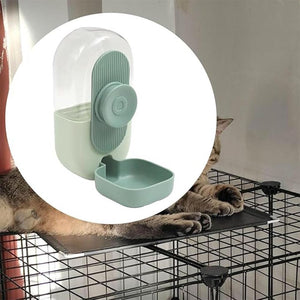 Pet water dispenser with a cat's paw reaching towards it inside a cage at Pet Servo