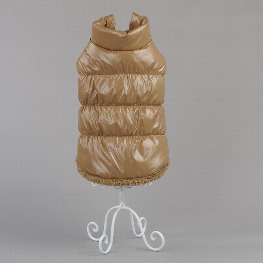 Beige puffer vest on a white stand against a gray background at Pet Servo