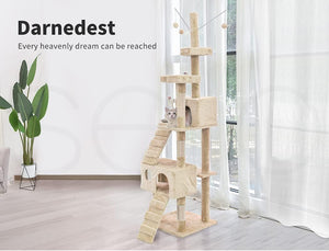 A tall beige cat tree with multiple platforms, a small, enclosed cave, stairs, and a hanging toy, shown in a bright room with white curtains, a plant, and a cat resting on one of the levels. Text on the left reads 'Darknets' and 'Every heavenly dream can be reached at Pet Servo