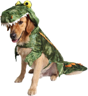 Dog wearing a green dinosaur costume on a white background