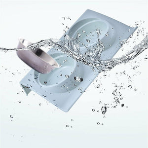 A white rectangular silicone mold with two oval cavities, shown with a splash of water and a metal ball entering one cavity against a light gray background at Pet Servo
