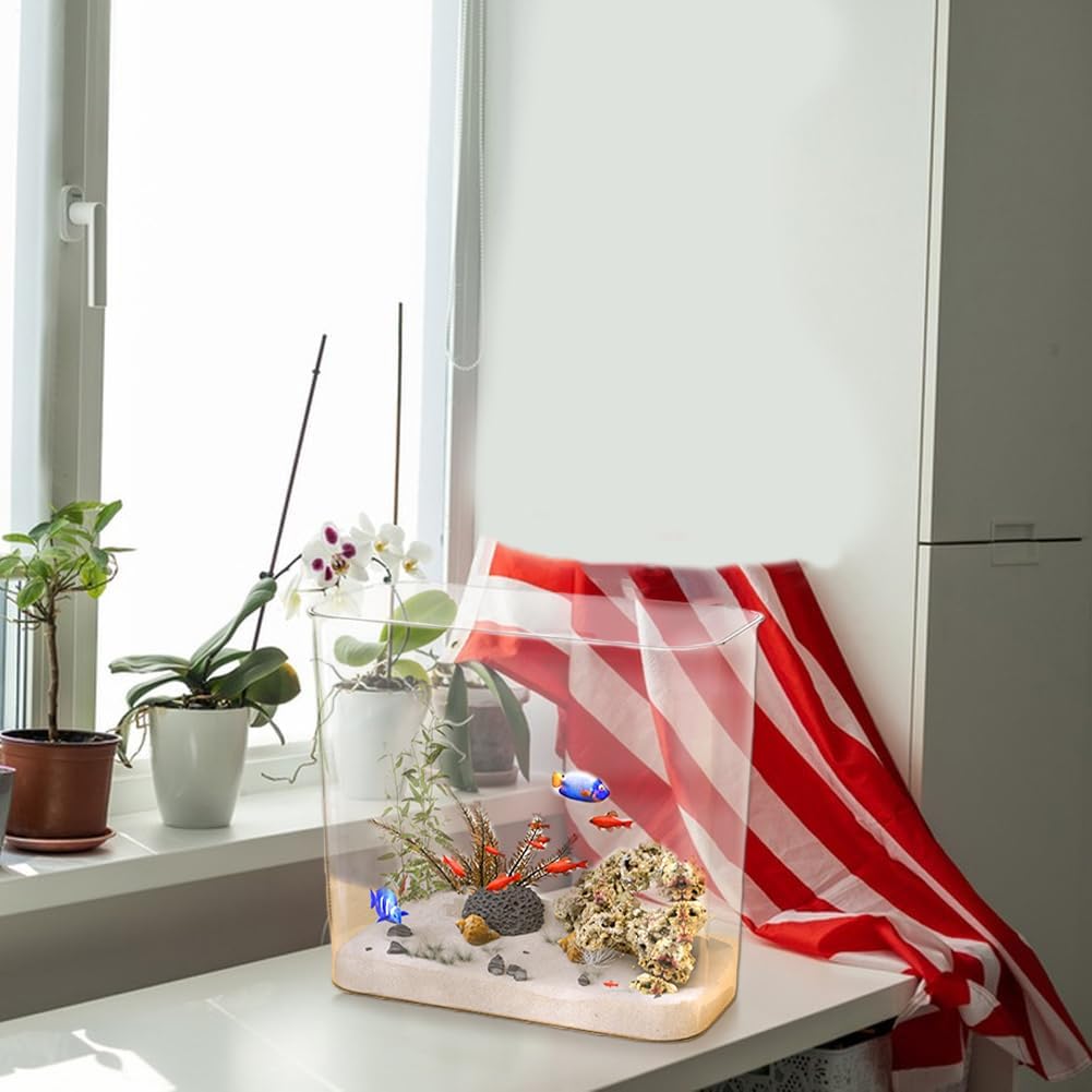 Small aquarium with decorative elements on a windowsill with plants at Pet Servo