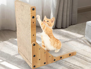 An orange and white cat sits on a wooden cat scratcher with a sisal-wrapped vertical scratching panel and a carpeted horizontal platform, in a bright room with curtains and a rug at Pet Servo