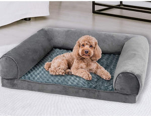 Dog lying on a gray pet bed in a home setting at Pet Servo